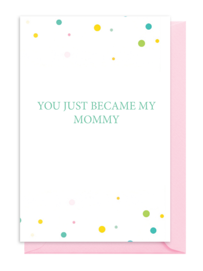 A baby book cover titled 'You Just Became My Mommy' with colorful dots and pink spine.