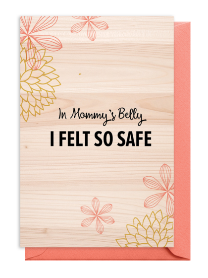 A warm wooden sign with floral designs and comforting text.