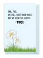 Two daisies in a field with a playful counting message.